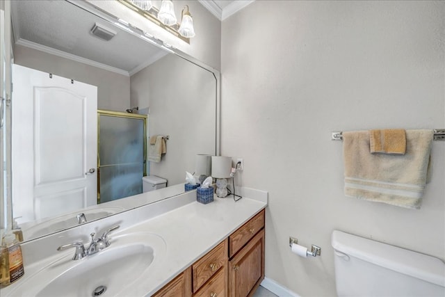 bathroom with vanity, toilet, crown molding, and an enclosed shower