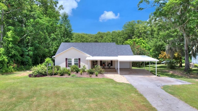 view of front of house featuring covered porch, a front yard, and a carport