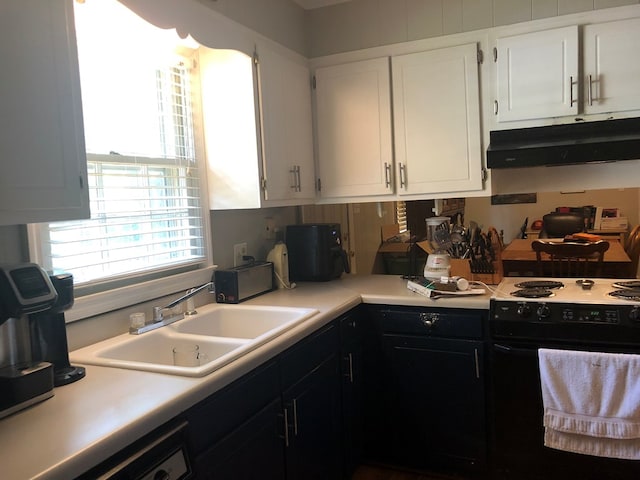 2814 Reeves Ln, Albany, GA 31721 - kitchen featuring under cabinet range hood, black electric range oven, light countertops, and white cabinetry