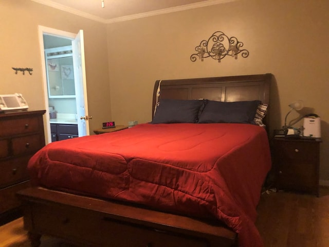 2814 Reeves Ln, Albany, GA 31721 - bedroom featuring ornamental molding, wood finished floors, and connected bathroom