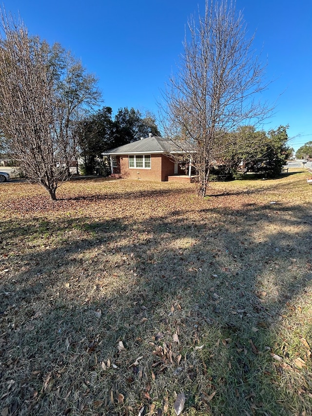 exterior space with a front lawn