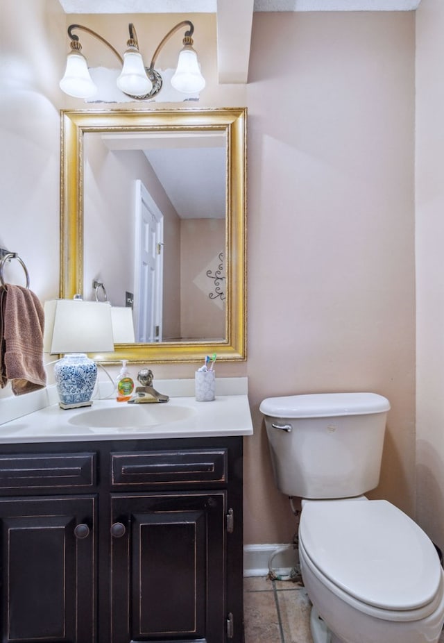 bathroom with toilet and vanity