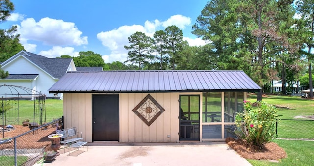 view of outdoor structure with a yard