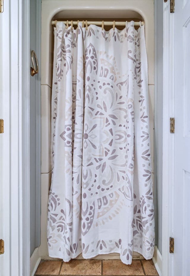 bathroom with tile patterned floors