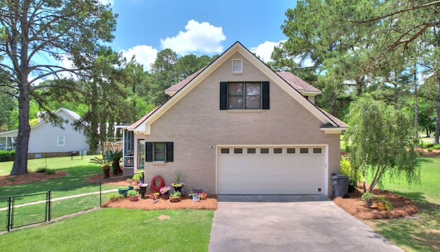 view of front of property featuring a garage and a front lawn