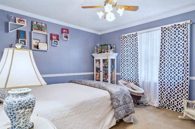 carpeted bedroom featuring ceiling fan, crown molding, and a textured ceiling