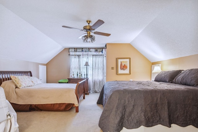 carpeted bedroom with ceiling fan, vaulted ceiling, and a textured ceiling