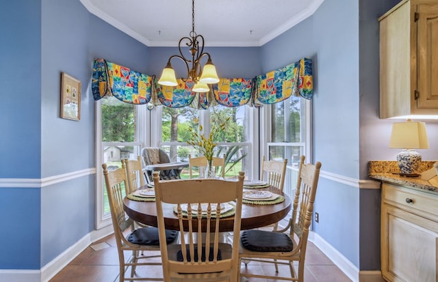 tiled dining room with a notable chandelier and ornamental molding