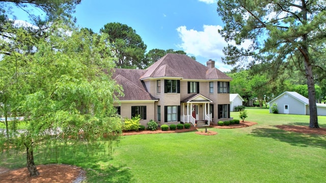 view of front of home with a front yard