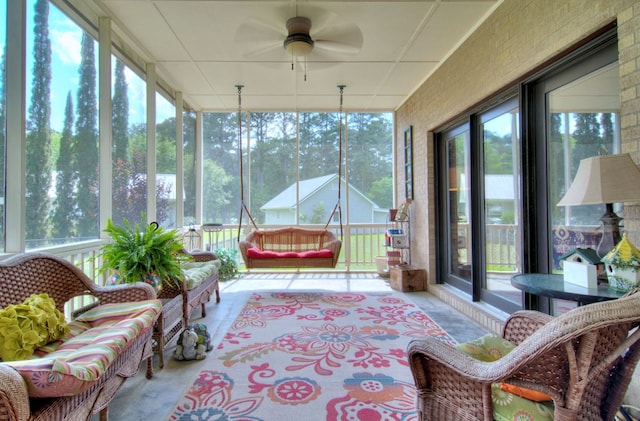 sunroom with ceiling fan and a wealth of natural light