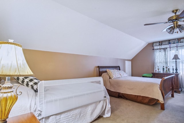 bedroom featuring lofted ceiling, carpet floors, and ceiling fan