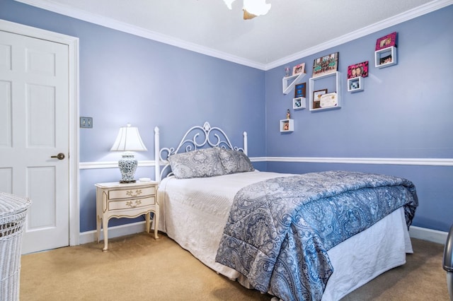 bedroom with carpet flooring, ceiling fan, and ornamental molding