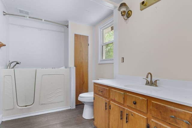 272 Ellis Rd, Plains, GA 31780 - full bathroom featuring vanity, toilet, a washtub, wood finished floors, and visible vents