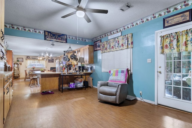 272 Ellis Rd, Plains, GA 31780 - sitting room featuring visible vents, light wood-style flooring, and ceiling fan with notable chandelier