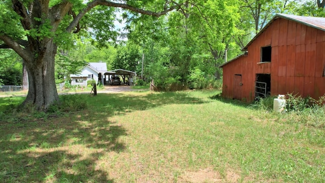 272 Ellis Rd, Plains, GA 31780 - view of yard with fence, a detached carport, an outbuilding, and a barn