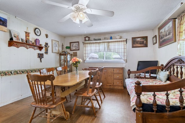 272 Ellis Rd, Plains, GA 31780 - dining area featuring a textured ceiling, a ceiling fan, and wood finished floors