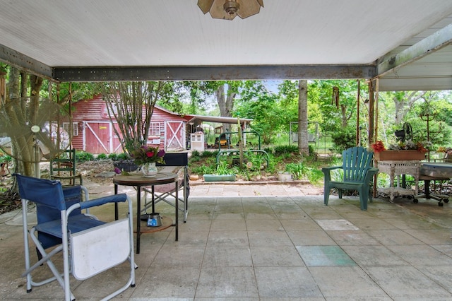 272 Ellis Rd, Plains, GA 31780 - view of patio featuring an outbuilding, outdoor dining area, and a shed