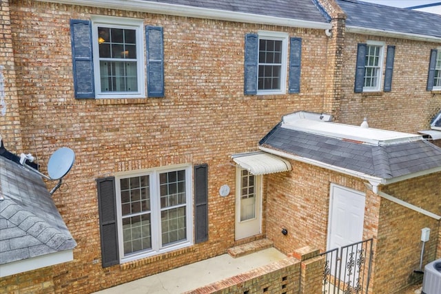 444 Kingswood Ct, Albany, GA 31707 - rear view of house featuring a shingled roof and brick siding