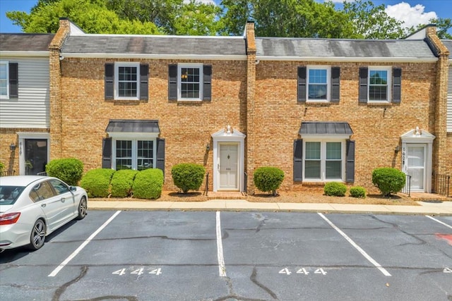 444 Kingswood Ct, Albany, GA 31707 - colonial house featuring uncovered parking, a shingled roof, brick siding, and a chimney