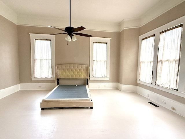 unfurnished bedroom featuring ceiling fan