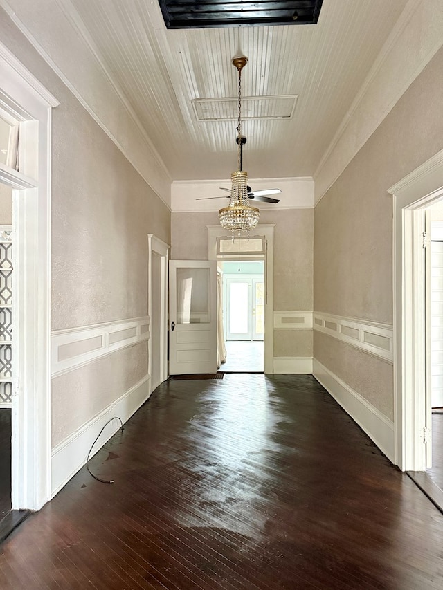 interior space featuring dark wood-type flooring and ornamental molding