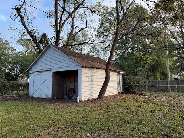 garage featuring a yard