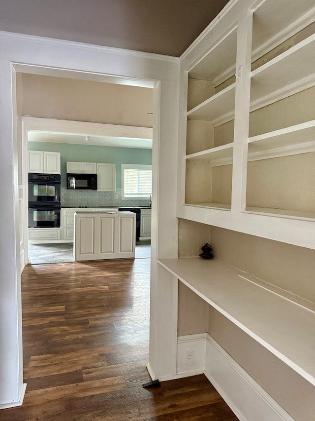 interior space with dark hardwood / wood-style floors