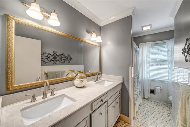 bathroom with vanity and ornamental molding