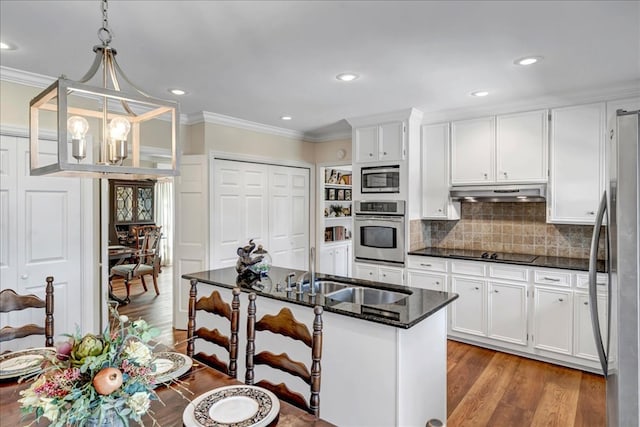 kitchen with sink, crown molding, white cabinets, and stainless steel appliances