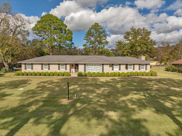 ranch-style home featuring a front yard