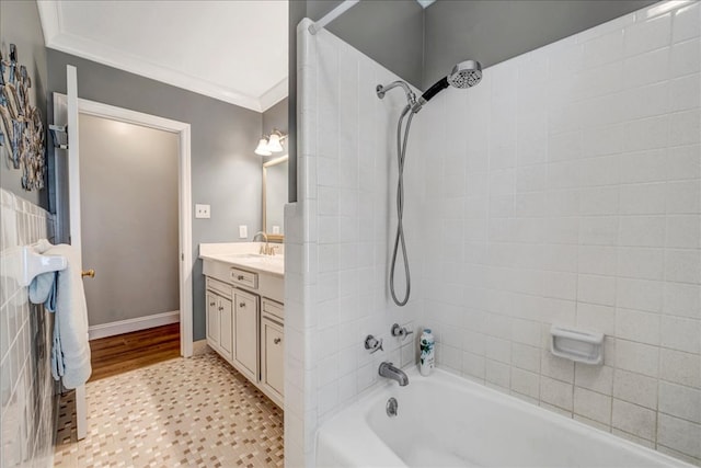 bathroom with crown molding, shower / tub combination, and vanity