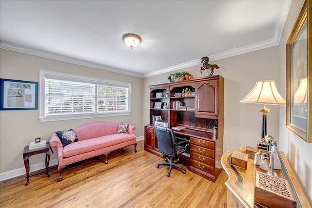 home office featuring light hardwood / wood-style floors and ornamental molding