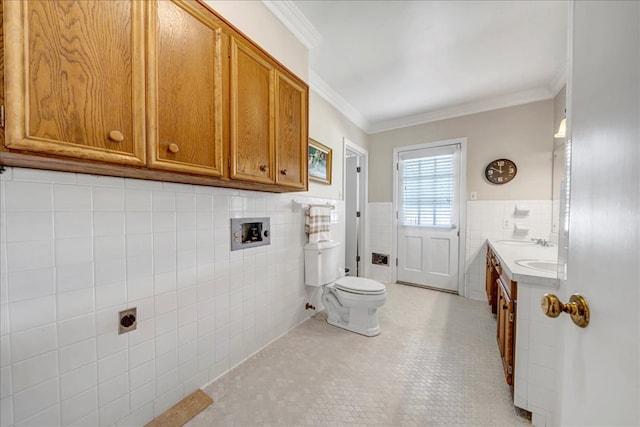 bathroom with vanity, toilet, tile walls, and crown molding