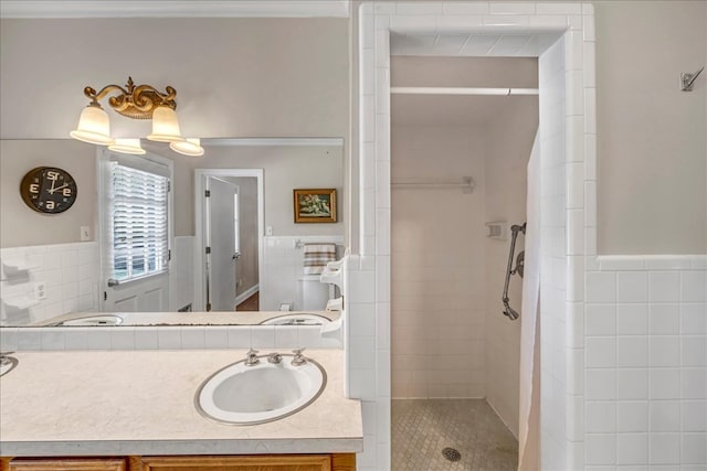 bathroom with vanity and a tile shower