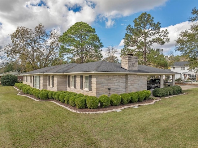 view of home's exterior with a carport and a lawn