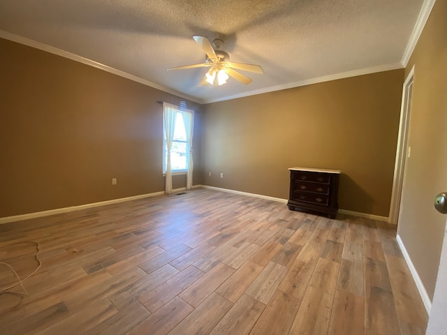 unfurnished room with crown molding, hardwood / wood-style floors, a textured ceiling, and ceiling fan