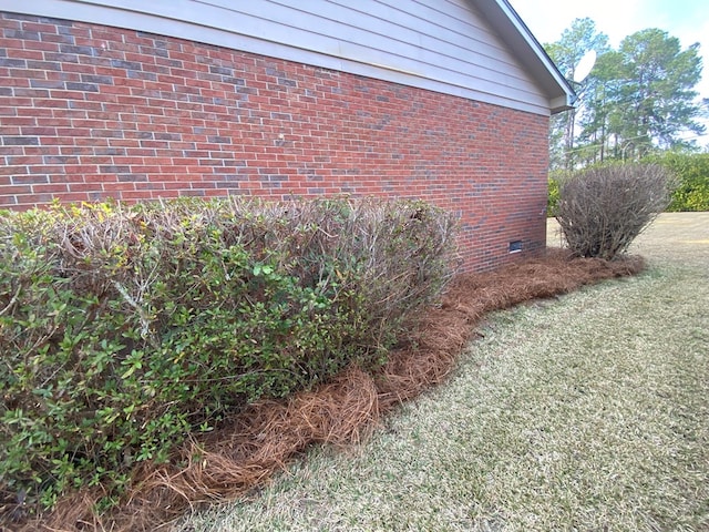 view of property exterior featuring a lawn