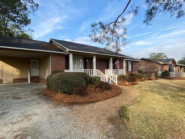 single story home with a carport and a porch