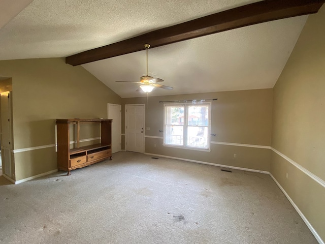 interior space featuring vaulted ceiling with beams, light colored carpet, a textured ceiling, and ceiling fan