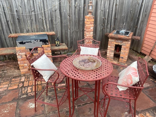 view of patio / terrace with a fireplace