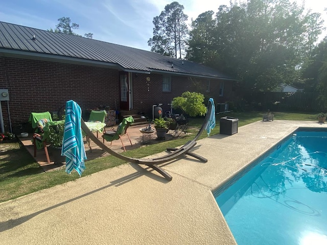 615 E 28th Ave, Cordele, GA 31015 - view of swimming pool featuring a patio area and fence