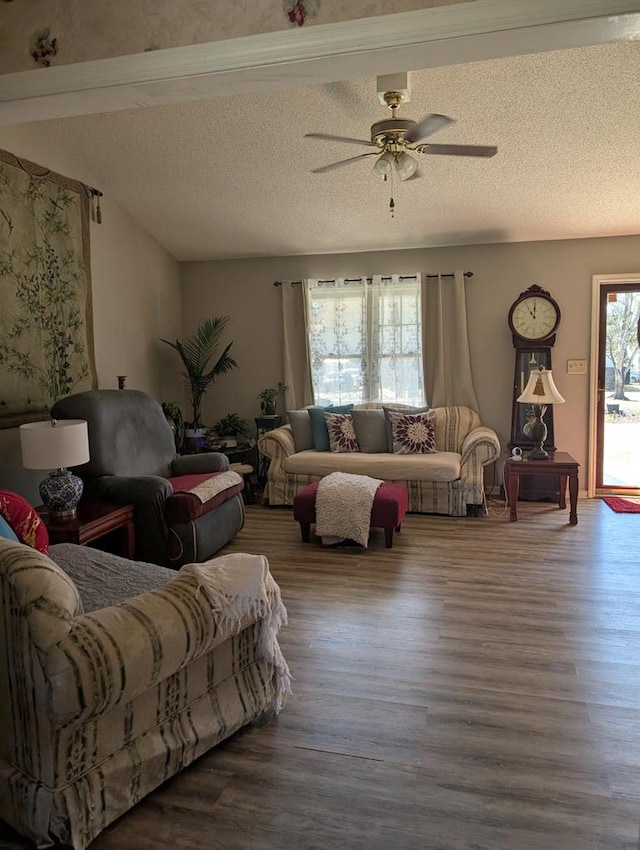 living room with ceiling fan, hardwood / wood-style floors, and a textured ceiling