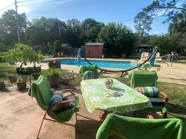 615 E 28th Ave, Cordele, GA 31015 - outdoor pool featuring a patio area, a shed, and an outdoor structure