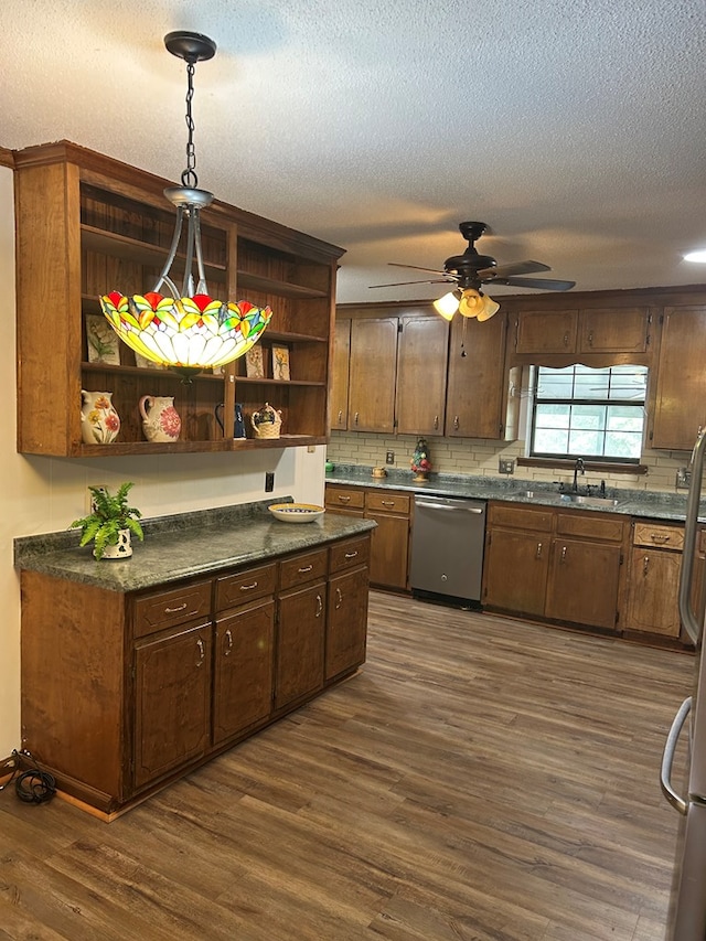 kitchen featuring backsplash, dark wood-type flooring, stainless steel dishwasher, open shelves, and a sink