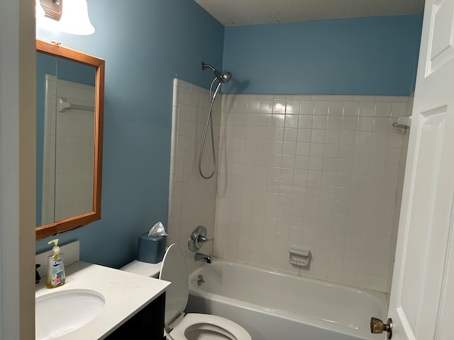 full bath with shower / bathing tub combination, vanity, toilet, and a textured ceiling