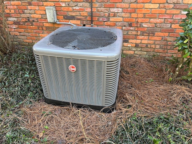 exterior details with brick siding and central AC unit