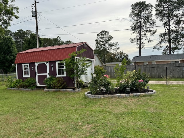 view of outbuilding with fence and an outdoor structure