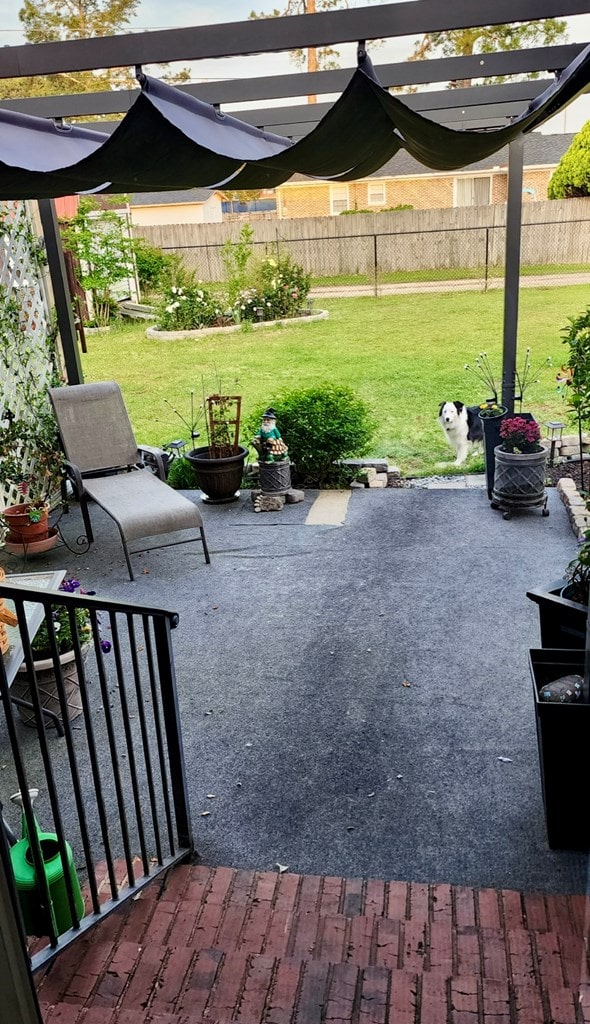 view of patio with a fenced backyard and a pergola