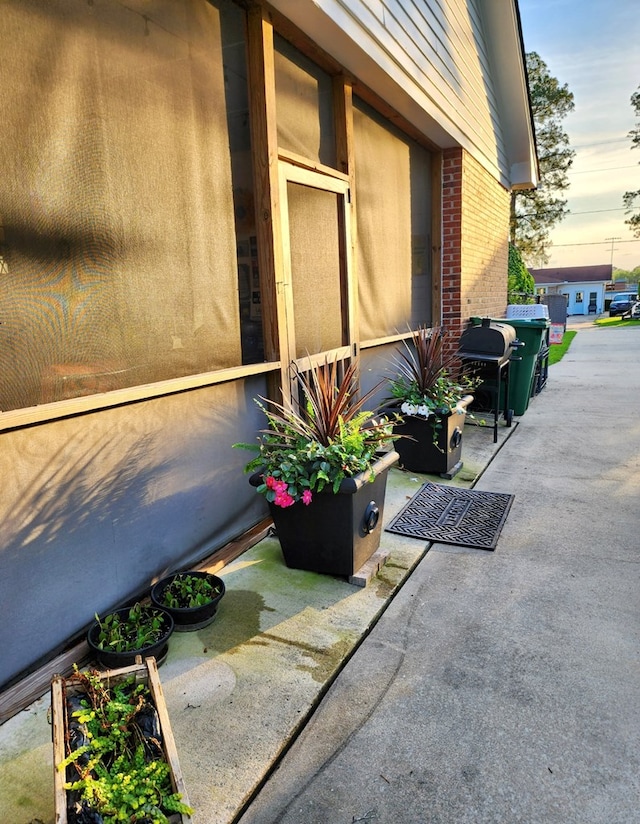 exterior space featuring brick siding
