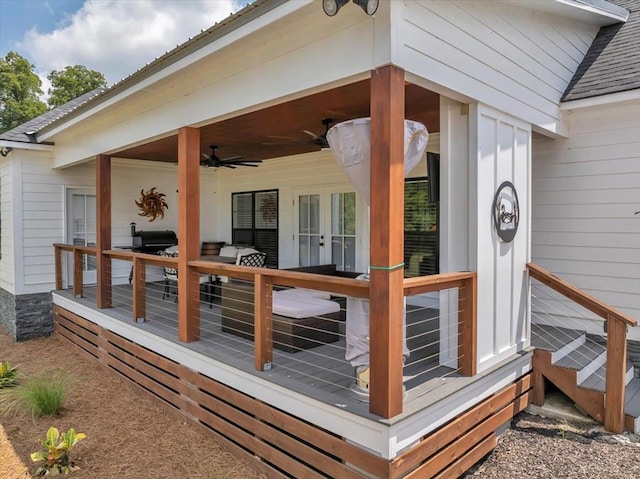 wooden deck featuring ceiling fan